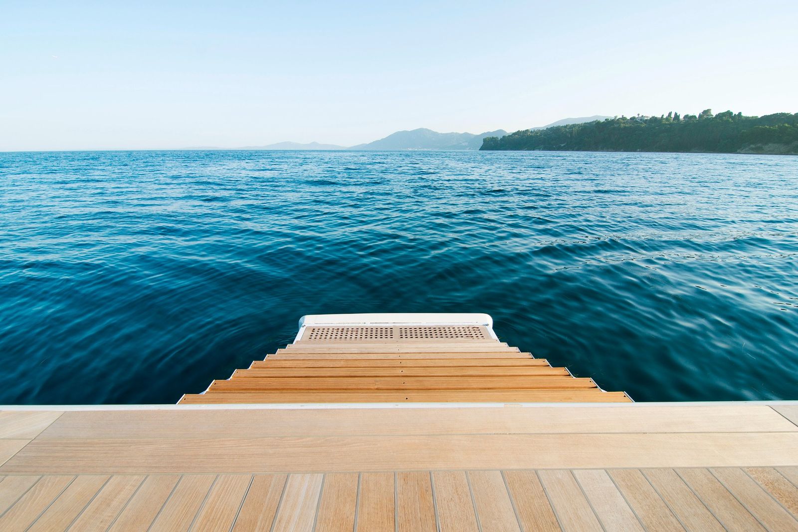 Teak yacht steps leading down to the sea